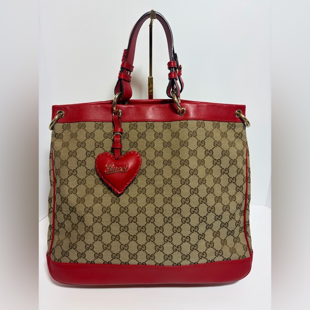 SOLD
Gucci Monogram w/ Red Leather Trim